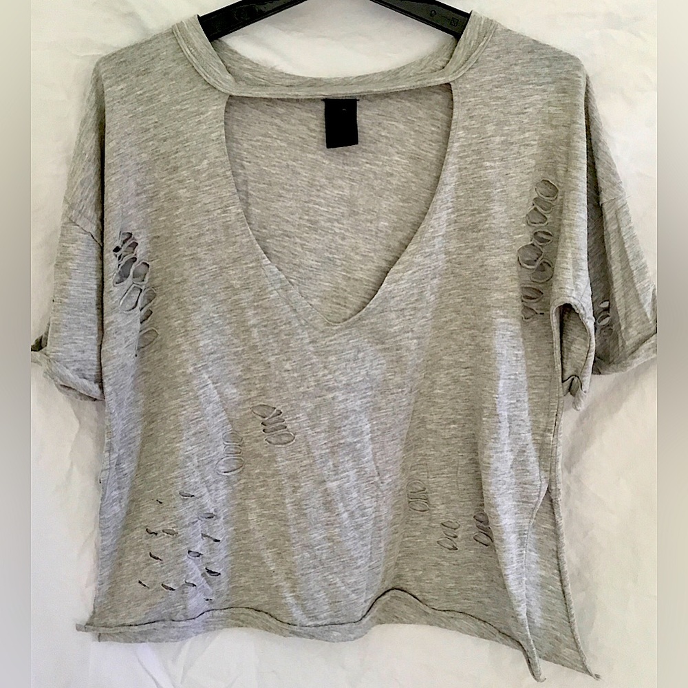 Infinite Performance distressed, torn top. S